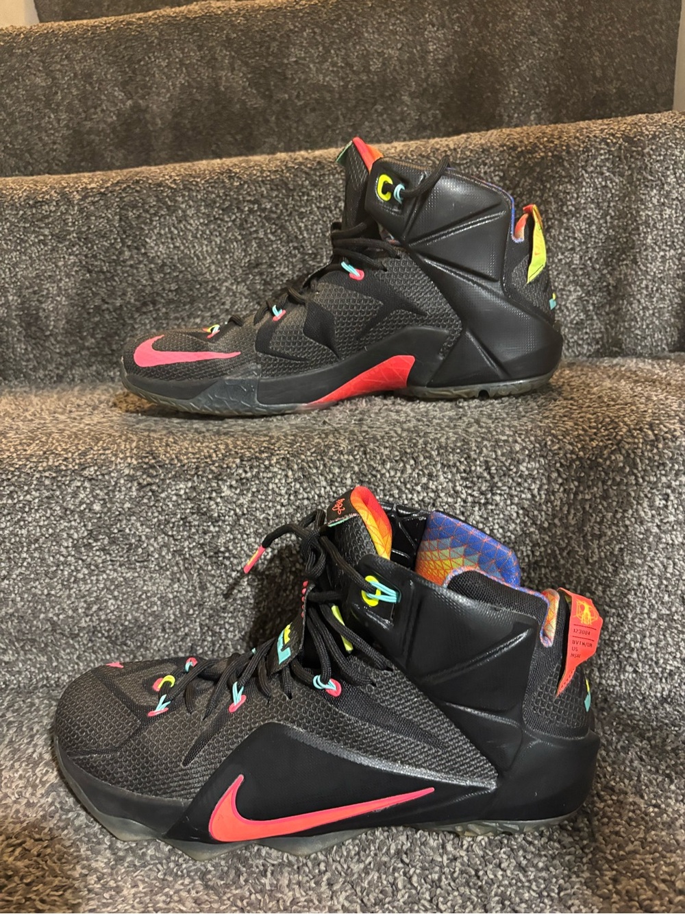 The Nike LeBron 12 Data Size 13 in black/orange colorway features icy bottoms,